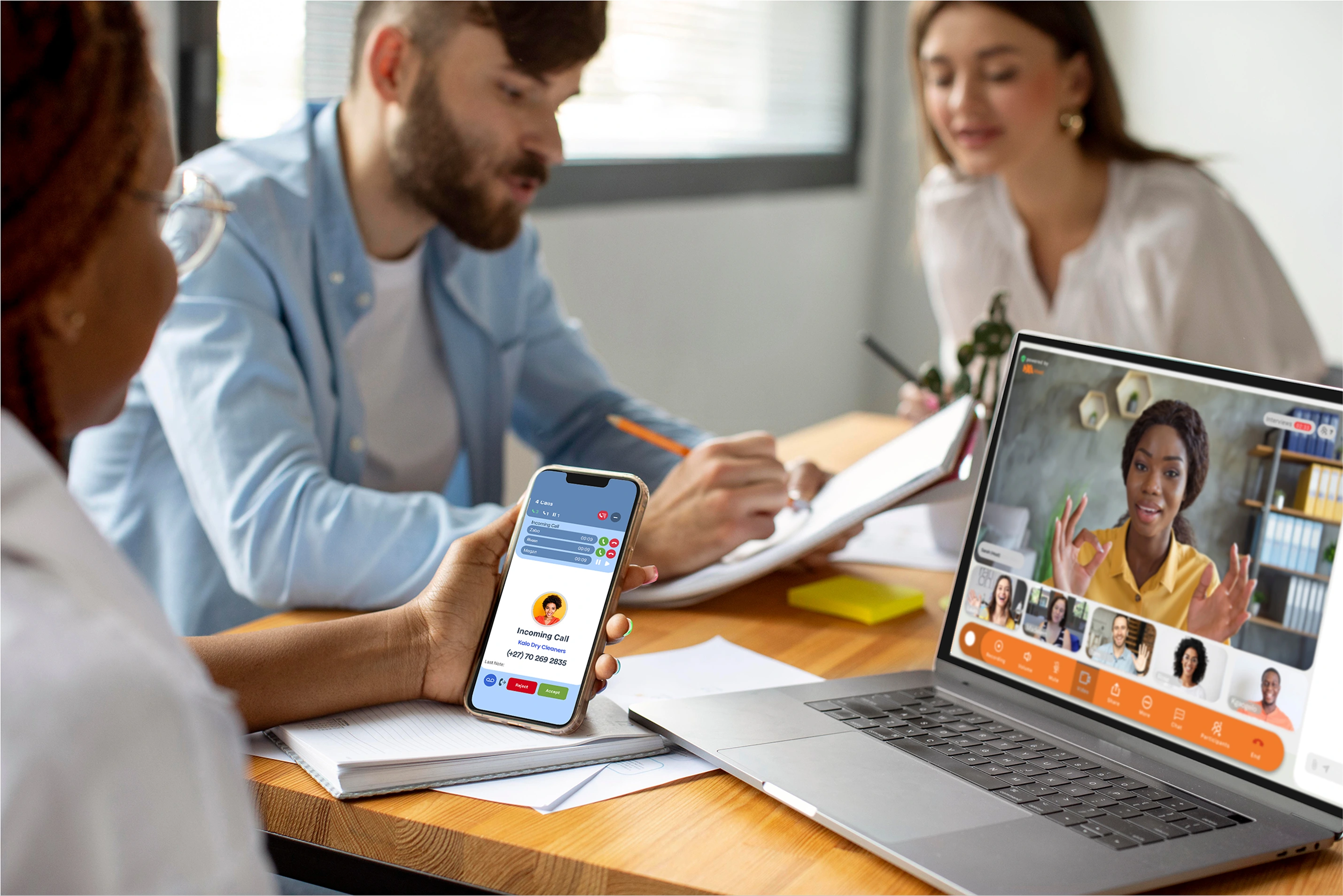 Team collaborating with NxaTel apps on phone and laptop